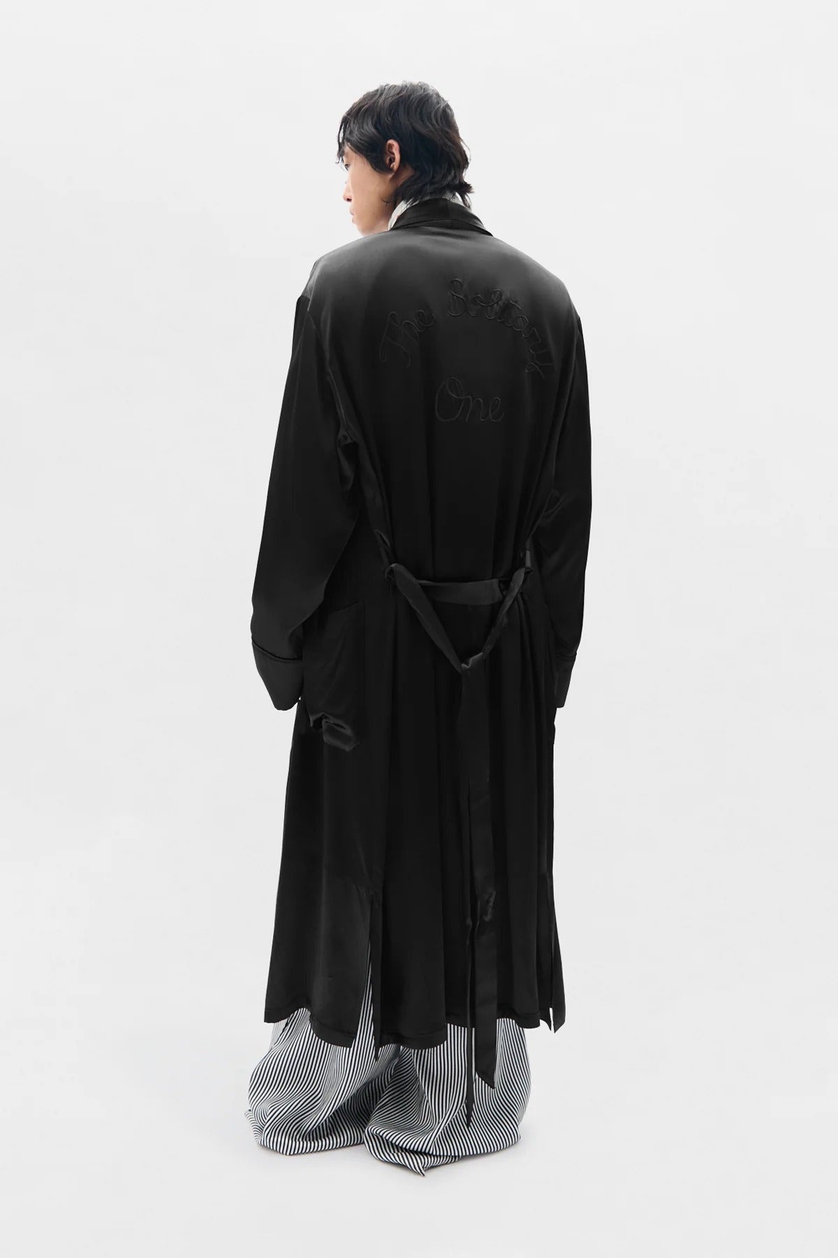 VORM FLUID BELTED LOUNGE COAT WITH "THE SOLITARY ONE" EMBROIDERY ON BACK BLACK
